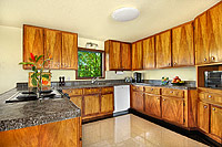 Kitchen with koa cabinets Poipu vacation rental